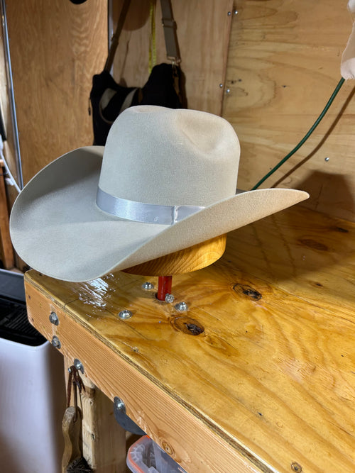 Western Skies silver grey felt cowboy hat on a hat stand in workshop